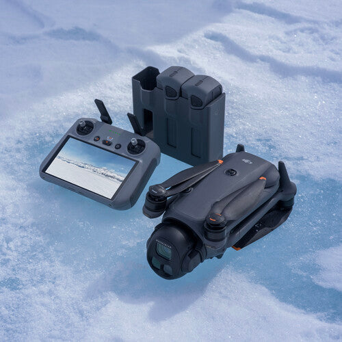 Drone and controller set on a snowy surface, DJI Mavic 4 Pro