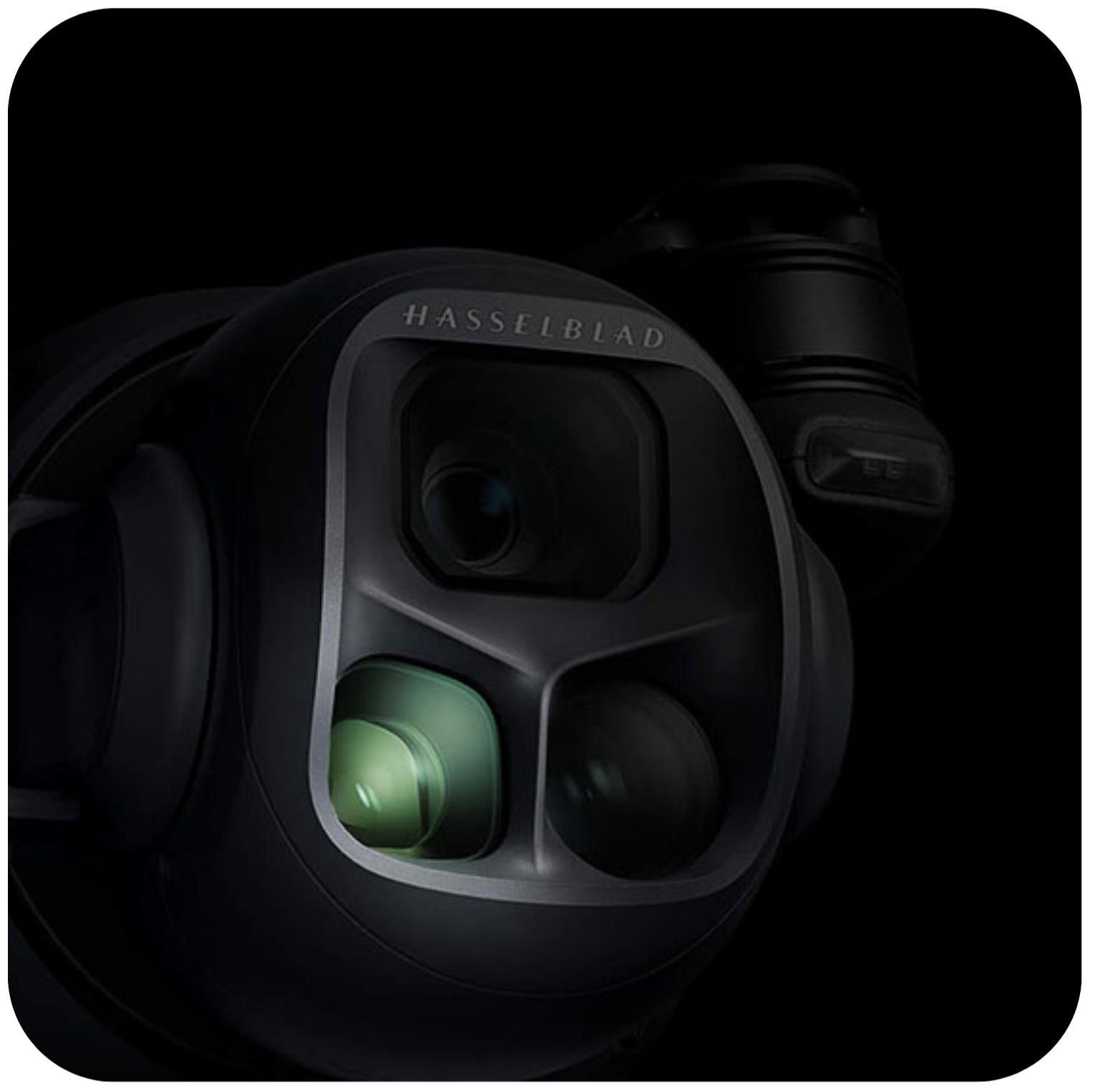 Close-up of a Hasselblad camera lens on a black background